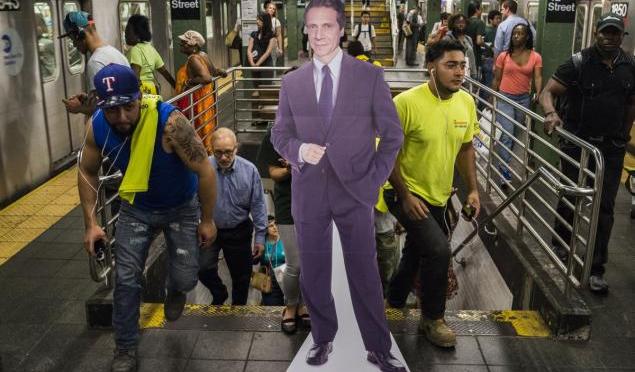Subway riders rip Andrew Cuomo for MTA funding by griping at cardboard replica of governor